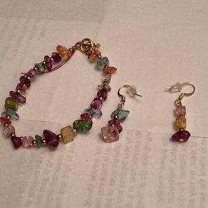 Bracelet is 7 and 1/2 inches long. The earrings are 1 and 1/2 inches long .